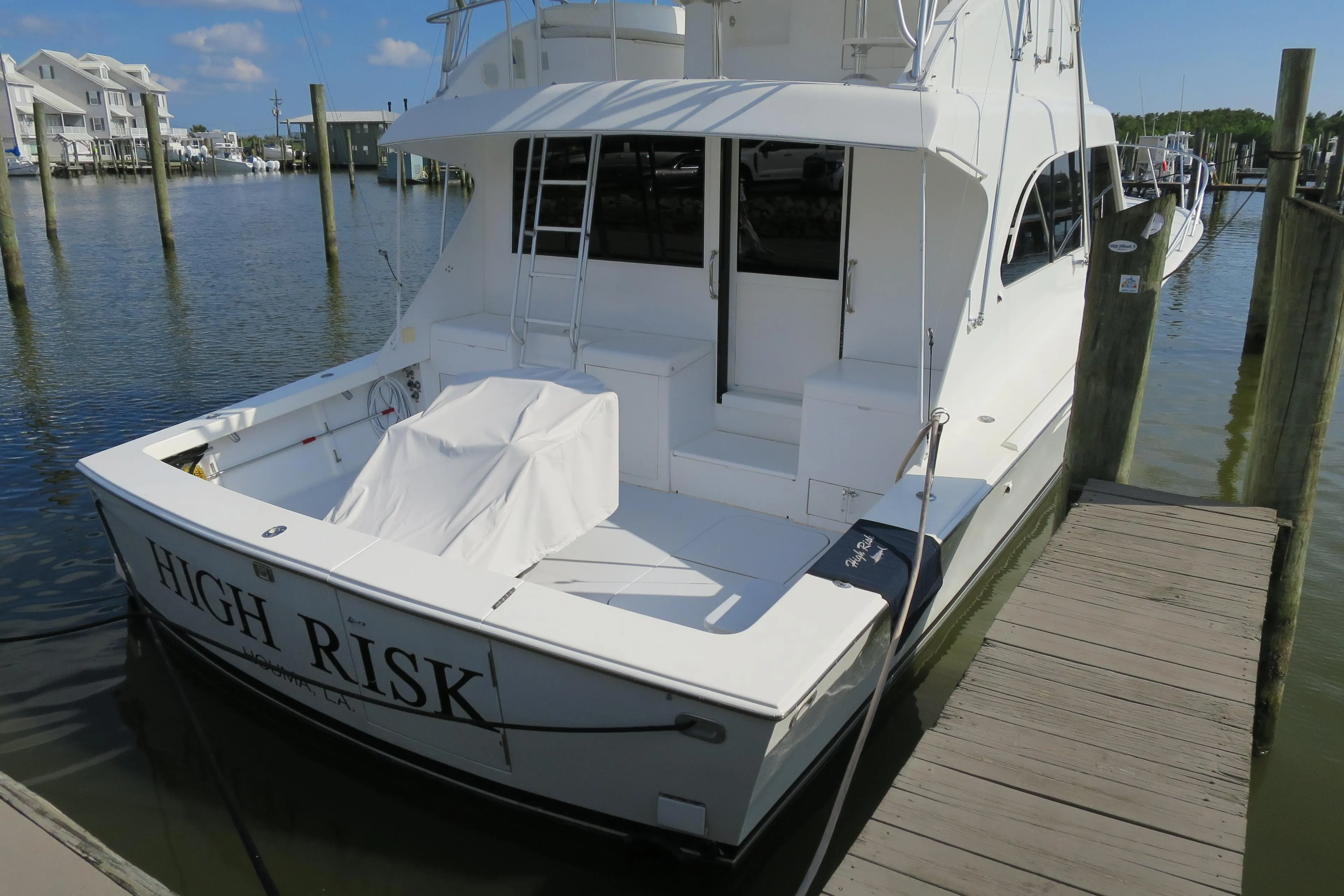 1997 Post 50 Flybridge yacht docked, named High Risk.