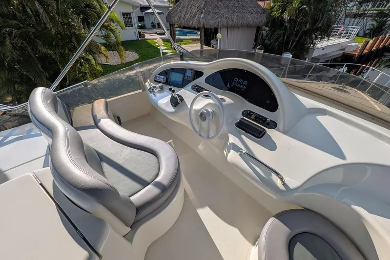  Yacht Photos Pics 2001 Azimut 46 yacht helm with modern controls and sleek seating.