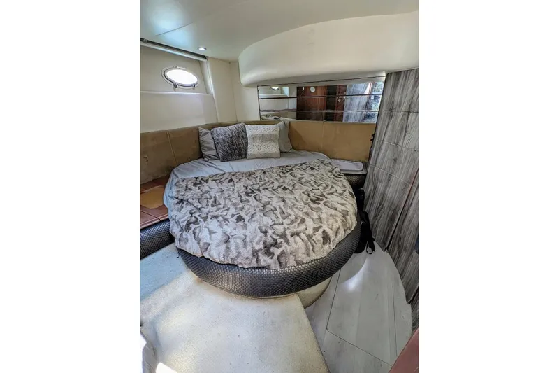  Yacht Photos Pics Cozy bedroom interior of 2001 Azimut 46 yacht with plush bedding and modern decor.