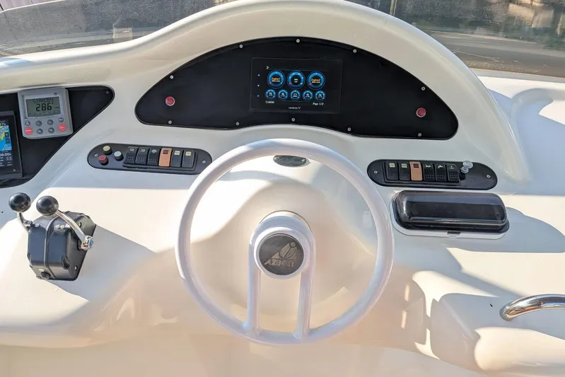  Yacht Photos Pics Cockpit of 2001 Azimut 46 yacht with steering wheel and control panel.