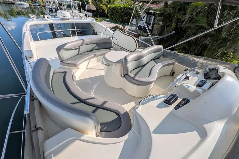  Yacht Photos Pics Luxurious seating area on a 2001 Azimut 46 yacht, featuring elegant design and comfort.