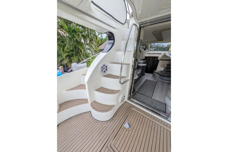  Yacht Photos Pics Interior view of 2001 Azimut 46 yacht with elegant staircase and seating area.