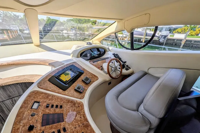  Yacht Photos Pics Luxurious helm of a 2001 Azimut 46 yacht with modern navigation equipment.