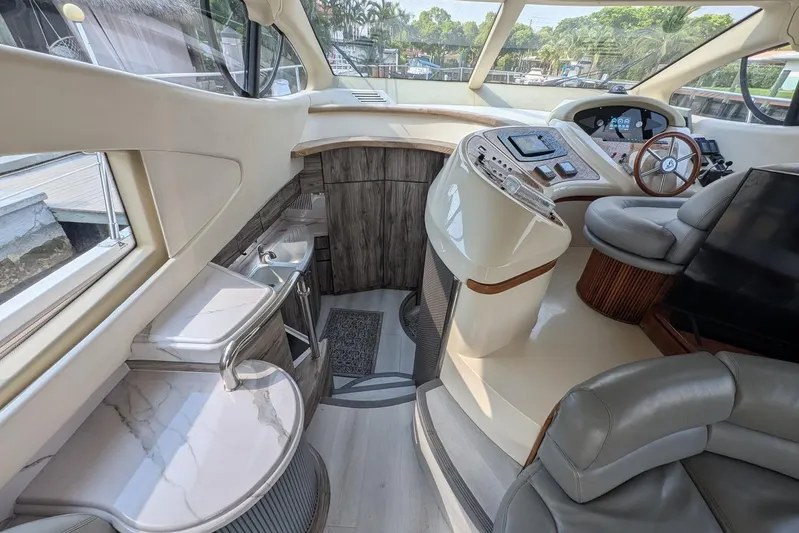  Yacht Photos Pics Luxurious interior of a 2001 Azimut 46 yacht with modern helm and seating area.