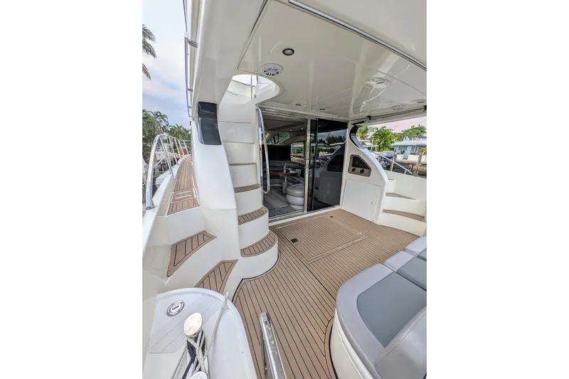  Yacht Photos Pics Luxurious 2001 Azimut 46 yacht interior with elegant wood flooring and modern seating.