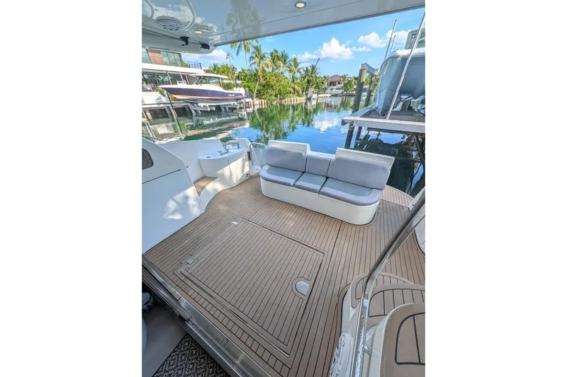  Yacht Photos Pics Luxurious 2001 Azimut 46 yacht deck with seating, overlooking serene waterfront.