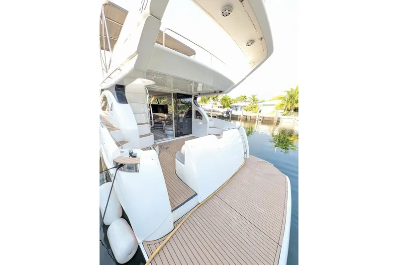  Yacht Photos Pics Luxurious 2001 Azimut 46 yacht with spacious deck and modern design, docked by serene waters.