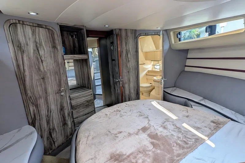  Yacht Photos Pics Luxurious interior of 2001 Azimut 46 yacht with cozy bedroom and modern bathroom.