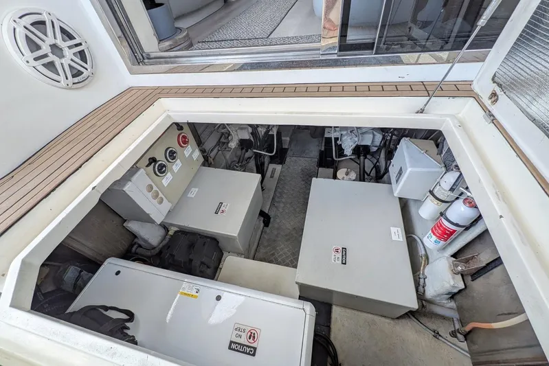  Yacht Photos Pics Engine room of a 2001 Azimut 46 yacht, featuring equipment and safety gear.