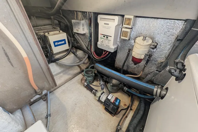  Yacht Photos Pics Engine room of a 2001 Azimut 46 yacht, featuring various mechanical components and wiring.