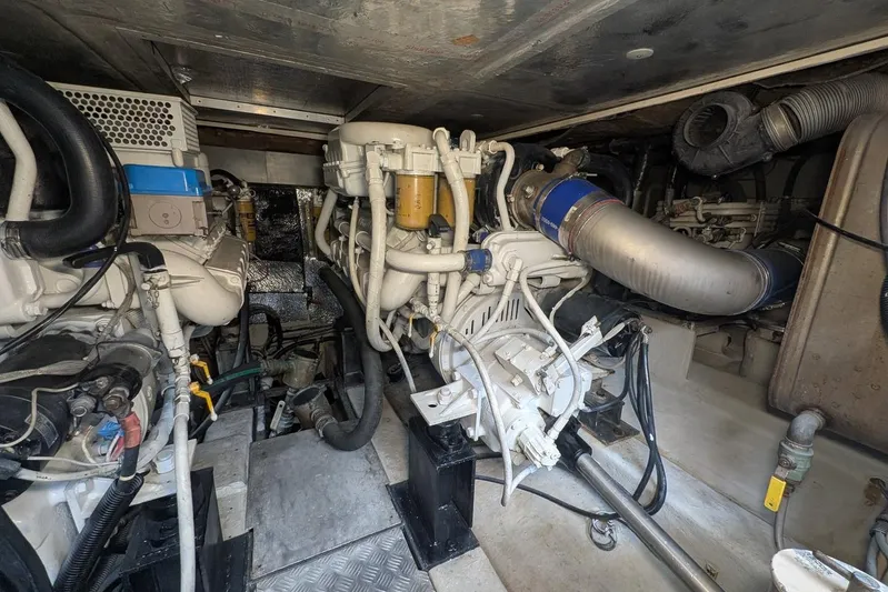  Yacht Photos Pics Engine room of a 2001 Azimut 46 yacht, showcasing mechanical components and piping.