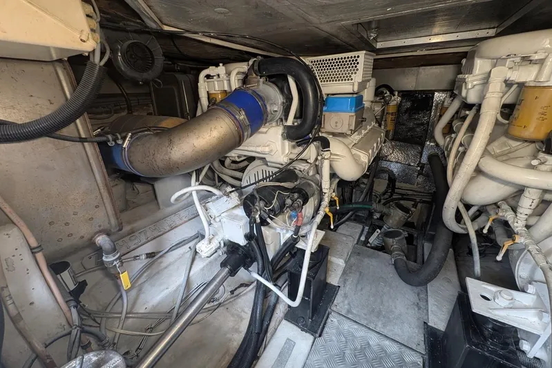  Yacht Photos Pics Engine room of a 2001 Azimut 46 yacht, showcasing mechanical components and piping.