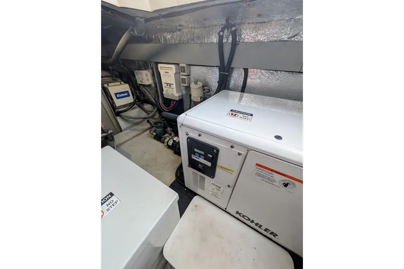  Yacht Photos Pics Engine room of 2001 Azimut 46 yacht featuring Kohler generator and electrical components.