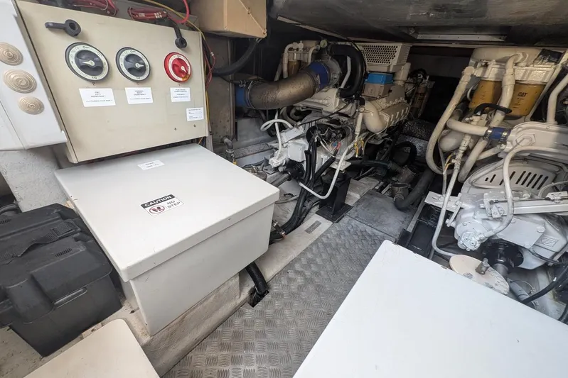  Yacht Photos Pics Engine room of a 2001 Azimut 46 yacht, featuring control panels and machinery.