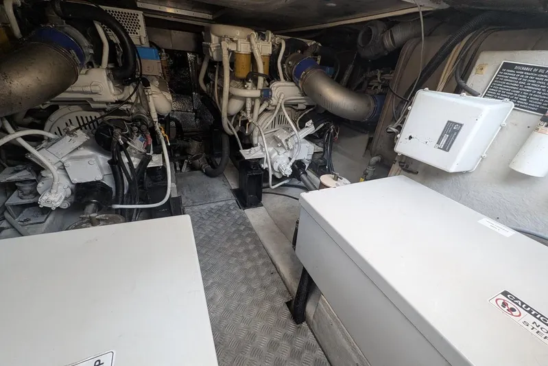  Yacht Photos Pics Engine room of a 2001 Azimut 46 yacht, showcasing mechanical components and equipment.