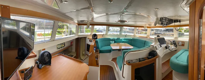 Magic Yacht Photos Pics Spacious interior of 2008 PDQ MV-41 yacht with modern amenities and panoramic windows.