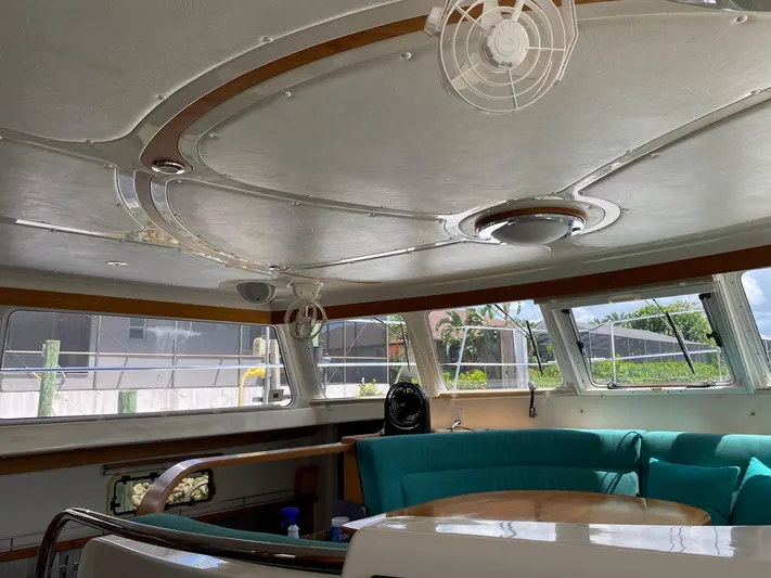 Magic Yacht Photos Pics Interior of 2008 PDQ MV-41 yacht with teal seating and modern design.