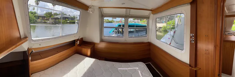 Magic Yacht Photos Pics Cozy cabin interior of 2008 PDQ MV-41 boat with scenic water views.