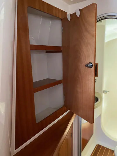 Magic Yacht Photos Pics Open wooden cabinet in PDQ MV-41 boat bathroom, 2008 model.