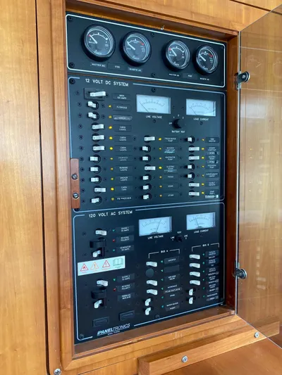 Magic Yacht Photos Pics Electrical control panel with gauges and switches in a wooden cabinet, PDQ MV-41, 2008 model.