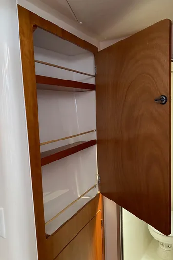 Magic Yacht Photos Pics Open wooden cabinet with shelves inside, PDQ MV-41, 2008 model.