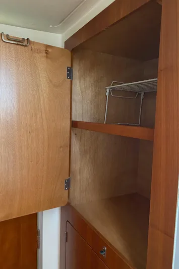 Magic Yacht Photos Pics Open wooden cabinet with shelves inside, PDQ MV-41, 2008 model.