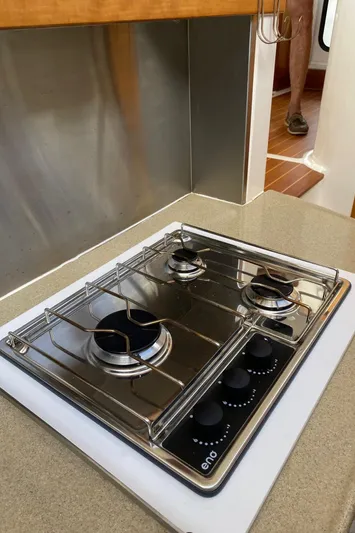 Magic Yacht Photos Pics Stainless steel three-burner stove on PDQ MV-41, 2008 model, in a compact kitchen setting.