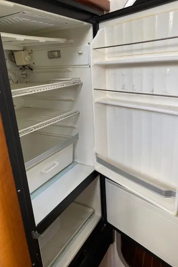 Magic Yacht Photos Pics Empty PDQ MV-41 refrigerator, 2008 model, with open door and visible shelves.