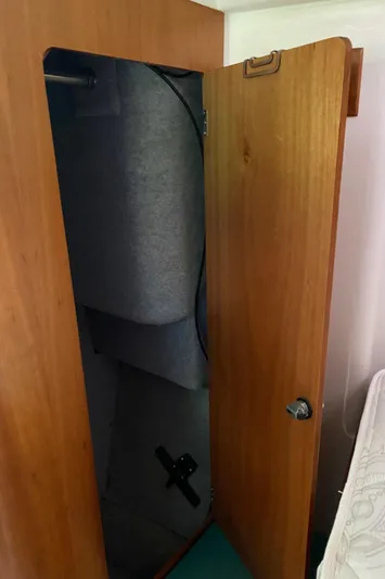 Magic Yacht Photos Pics Wooden closet with open door revealing interior storage space, PDQ MV-41, 2008 model.