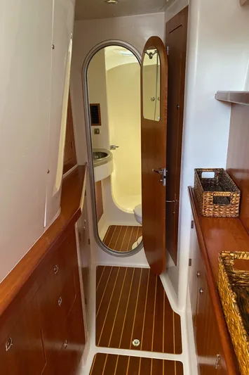 Magic Yacht Photos Pics Interior of 2008 PDQ MV-41 yacht with wooden cabinetry and bathroom view.