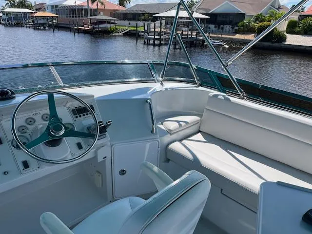 Magic Yacht Photos Pics 2008 PDQ MV-41 boat interior with steering wheel and seating, dockside view.