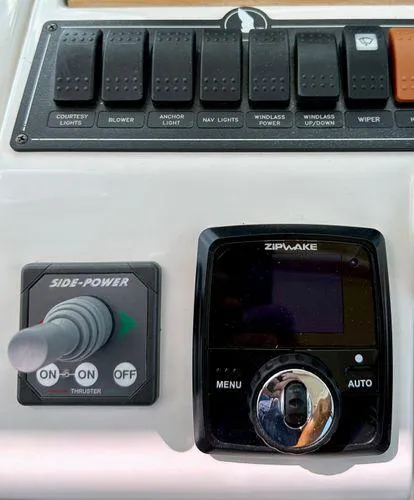 Fin & Tonic Yacht Photos Pics Control panel of a 2020 Back Cove 34O boat with Side-Power and Zipwake systems.