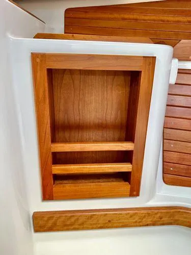 Fin & Tonic Yacht Photos Pics Wooden shelving on a 2020 Back Cove 34O boat interior.