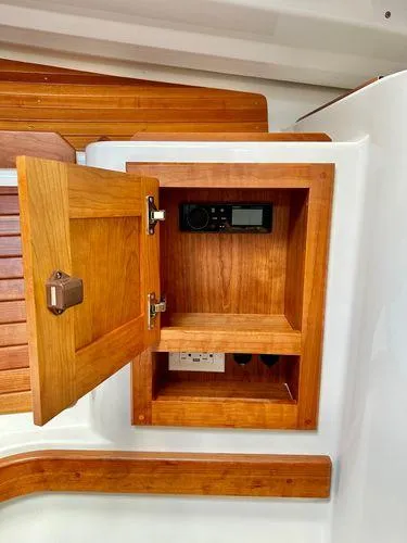 Fin & Tonic Yacht Photos Pics Back Cove 34O 2020 model, wooden cabinet with electronic controls inside.
