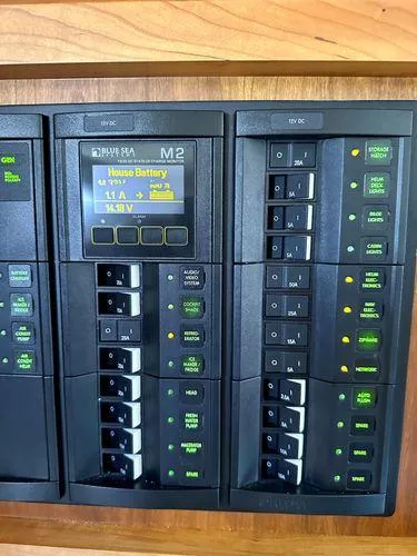 Fin & Tonic Yacht Photos Pics Electrical panel of 2020 Back Cove 34O boat, displaying battery status and switches.