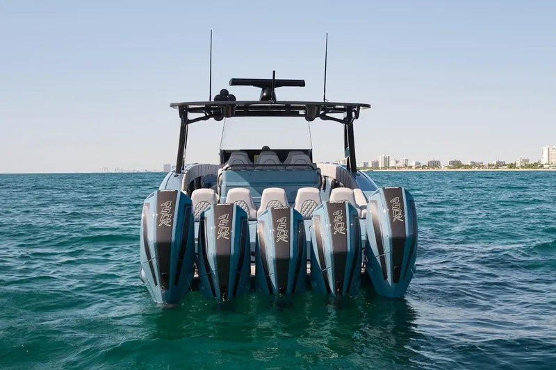  Yacht Photos Pics 2023 Midnight Express 43' Open boat with five powerful outboard engines on the ocean.