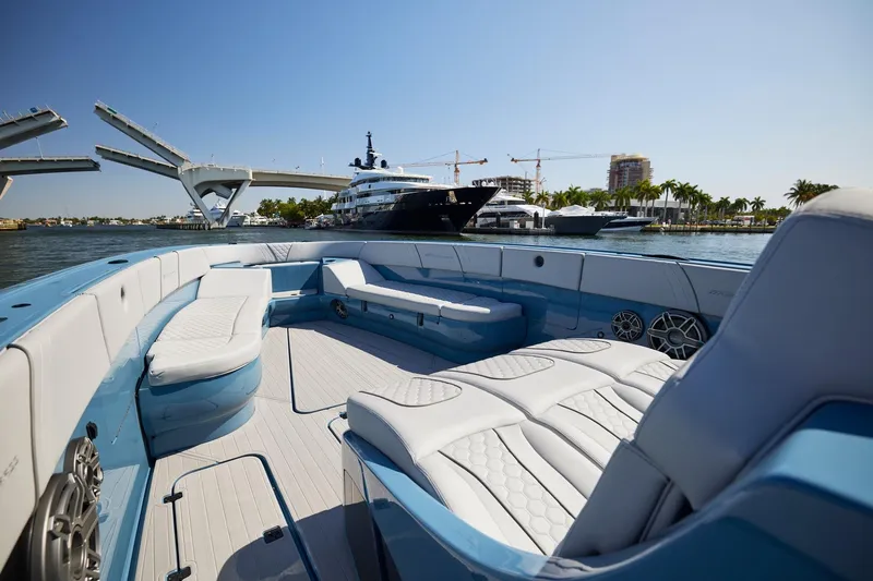  Yacht Photos Pics 2023 Midnight Express 43' Open luxury boat interior with bridge and yachts in background.