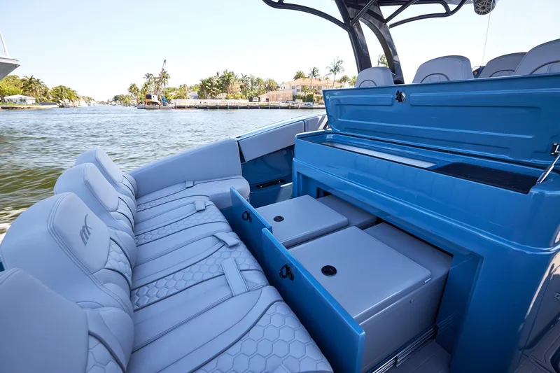  Yacht Photos Pics 2023 Midnight Express 43' Open boat interior with seating and storage, on a scenic waterway.