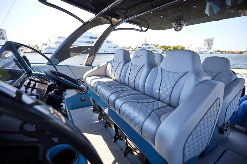  Yacht Photos Pics Luxurious interior of 2023 Midnight Express 43' Open boat with plush seating.