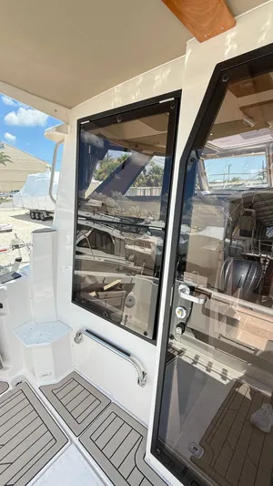  Yacht Photos Pics 2026 Cutwater C-288 Coupe boat interior with sleek glass doors and modern design.