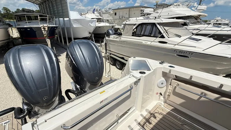  Yacht Photos Pics 2026 Cutwater C-288 Coupe with dual outboard engines in a marina setting.