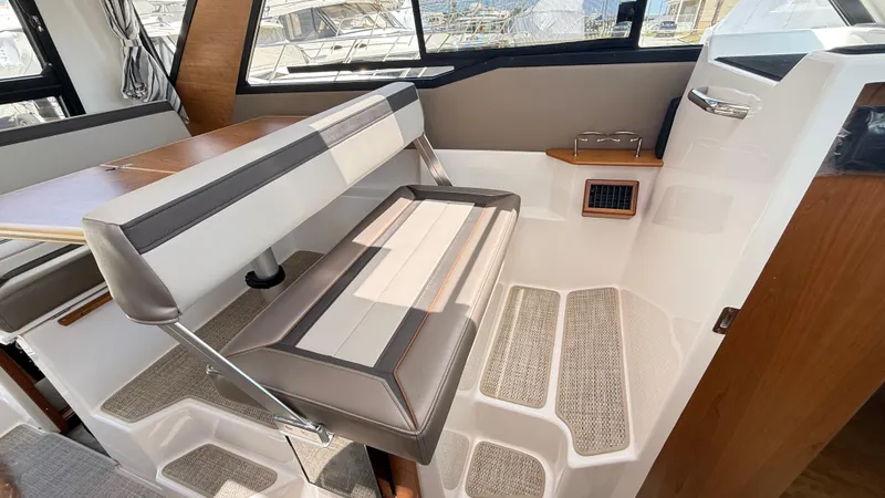  Yacht Photos Pics 2026 Cutwater C-288 Coupe interior seating with table and window view.