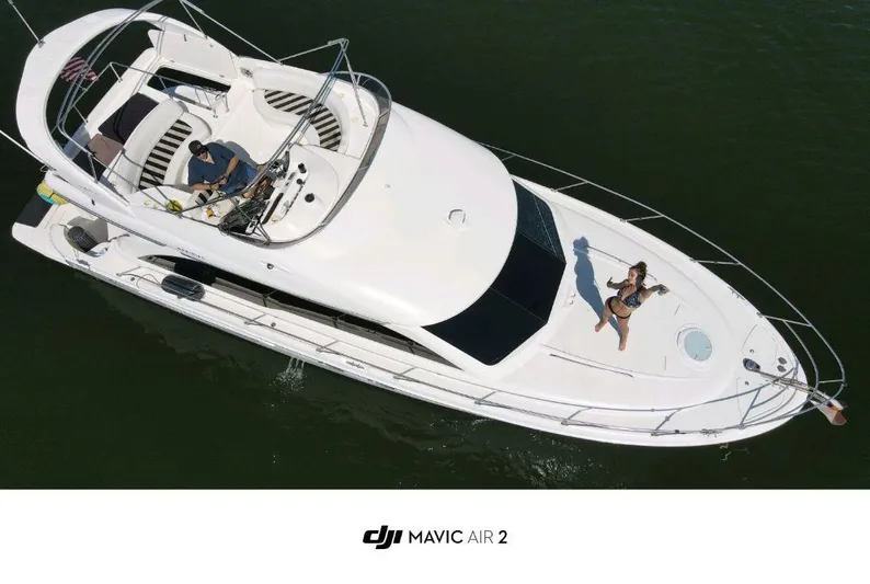  Yacht Photos Pics Aerial view of 2006 Meridian 411 Sedan yacht on water.