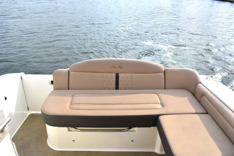  Yacht Photos Pics 2016 Sea Ray 310 Sundancer boat with beige seating on calm water.
