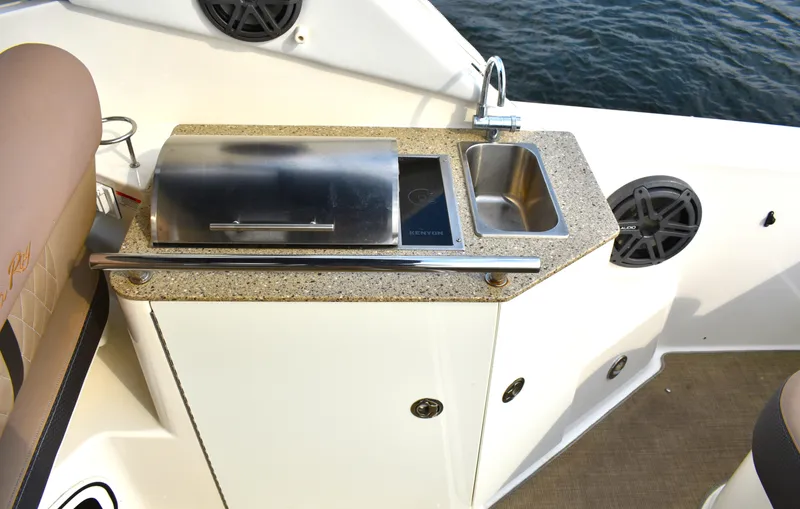  Yacht Photos Pics Outdoor kitchenette on 2016 Sea Ray 310 Sundancer boat with grill and sink.