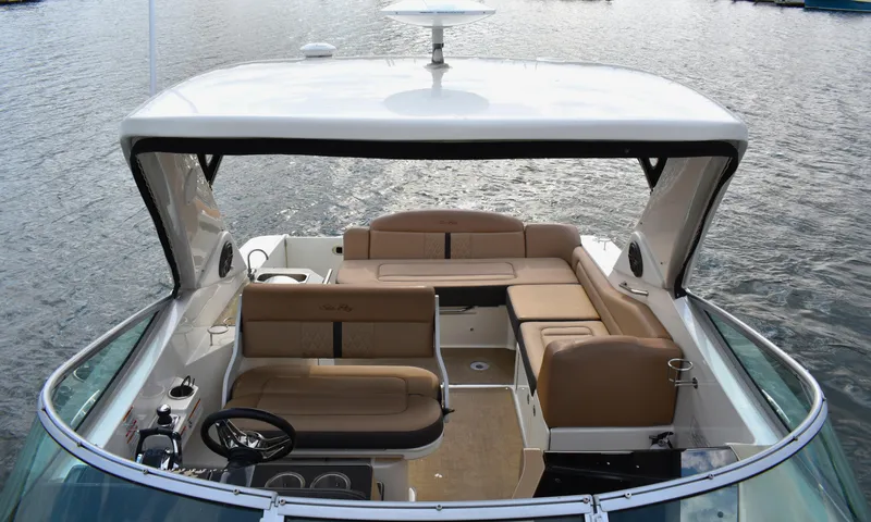  Yacht Photos Pics 2016 Sea Ray 310 Sundancer boat with spacious seating on calm water.