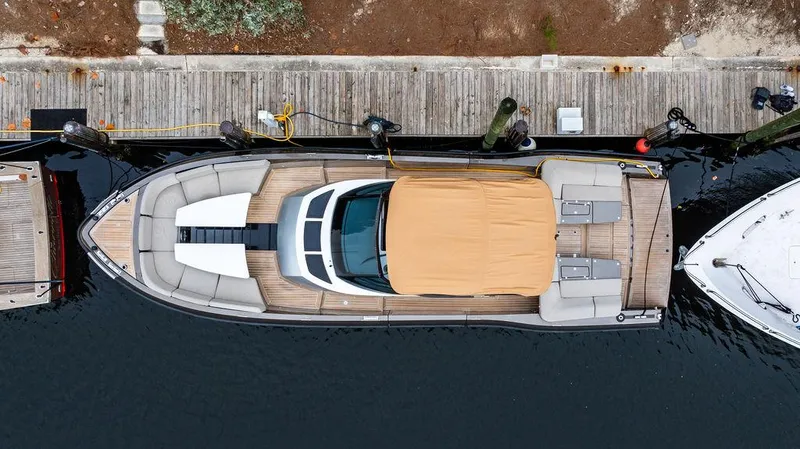  Yacht Photos Pics Aerial view of 2015 CNM 43 Continental yacht docked at a wooden pier.