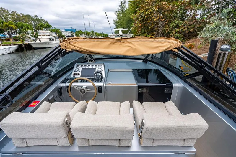  Yacht Photos Pics 2015 CNM 43 Continental boat interior with beige seats and control panel.