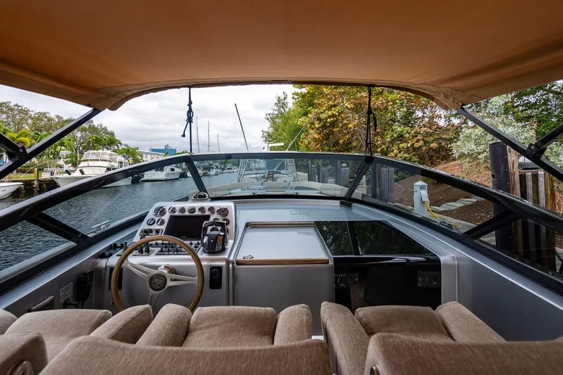  Yacht Photos Pics Interior view of 2015 CNM 43 Continental yacht cockpit with steering wheel and controls.