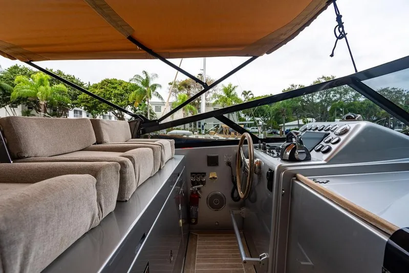  Yacht Photos Pics Luxurious 2015 CNM 43 Continental yacht interior with plush seating and modern controls.